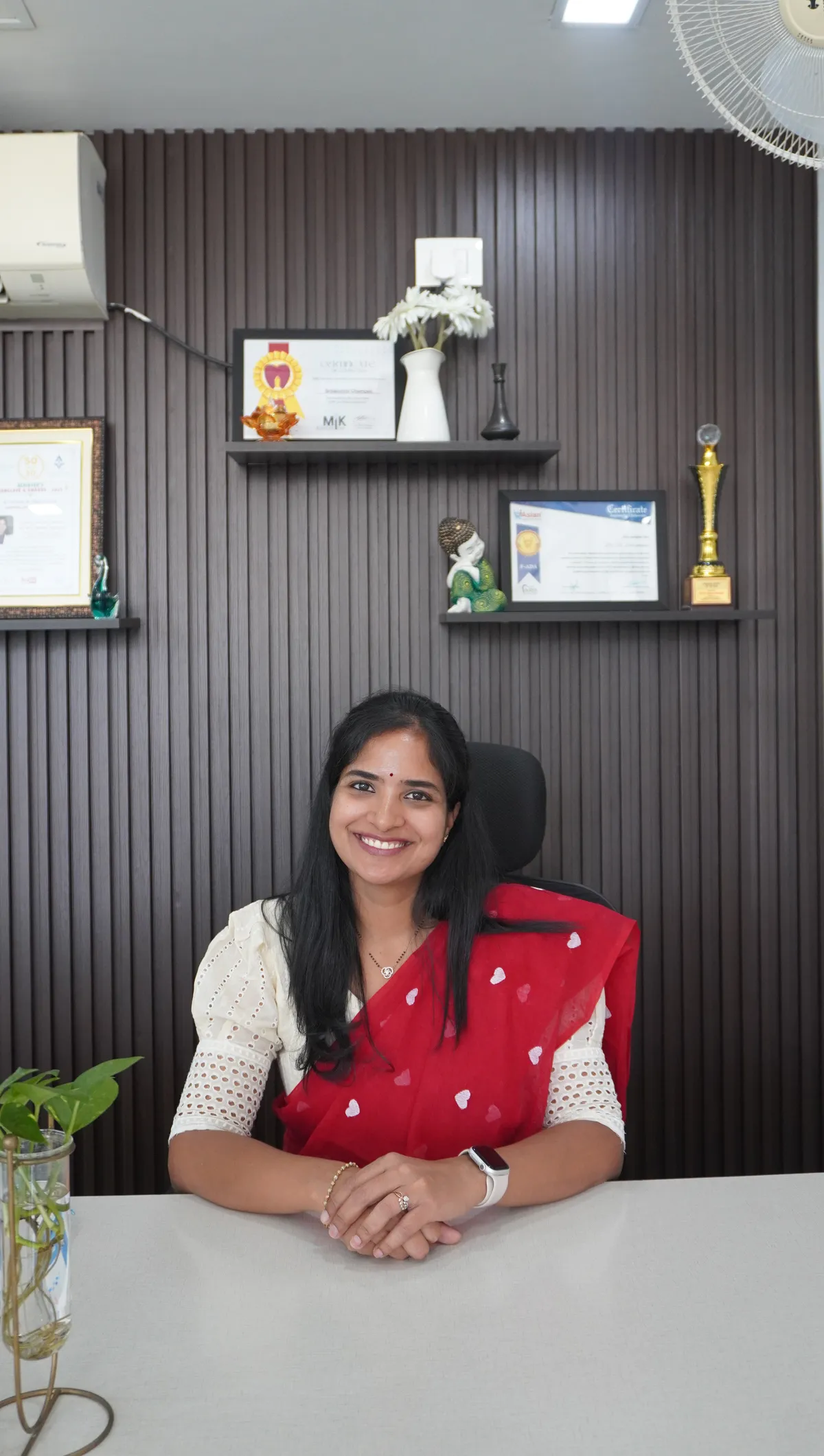 Dr. Srilakshmi Champati, BDS dentist and implantologist, at her consulting desk in Hyderabad